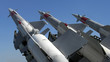 Three missiles against clear blue sky Three missiles against clear blue sky