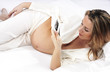 pregnant woman carrying her child's ultrasound picture