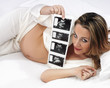 pregnant woman carrying her child's ultrasound picture