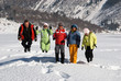 Jumping friends in winter mountain
