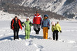 Jumping friends in winter mountain