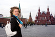 Smiling woman standing on the Red Square in Moscow, Russia