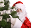 Photo : Santa Claus holding money. Isolated.