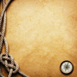 compass and rope on grunge background