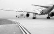 Planes on foggy runway