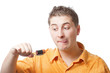 man trying to eat battery