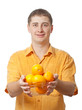 man with orange fruits in hands