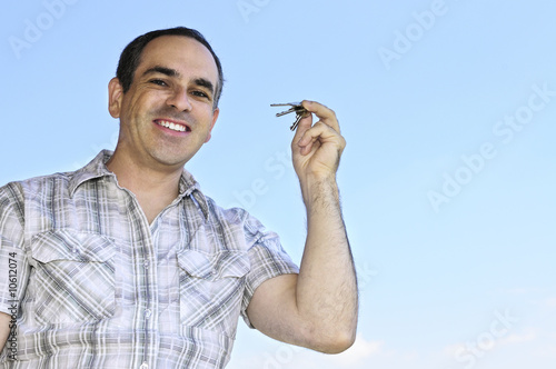 Photo: Man holding keys Man holding keys