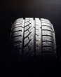 Brand new winter tire pattern on black background