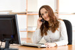 Beautiful businesswoman talking by phone
