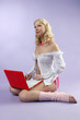 Young women with red laptop Young women with red laptop