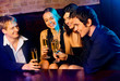 Two happy couples with champagne glasses at celebration Two happy couples with champagne glasses at celebration