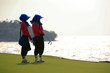 caddies waiting by the seaside course
