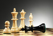 A game of chess comes to an end. The king is checkmated..