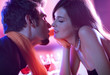 Young kissing amorous couple at celebration