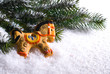 Pine branches with snow and gingerbread