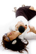 high angle view of businesswoman lying down holding a microphone