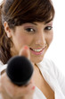 front view of female executive offering mic to sing