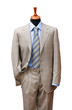 Posh suit on shop mannequin isolated on white