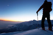 backcountry skier reaching the summit of the mountain backcountry skier reaching the summit of the mountain