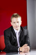Serious businessman at office looking at the camera Serious businessman at office looking at the camera