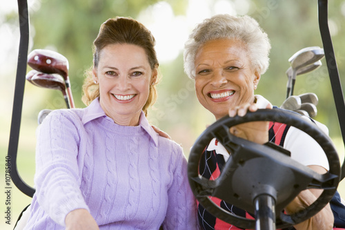 Photo: Portrait Of Two Female Golfers Portrait Of Two Female Golfers