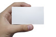 Hand with white textured card for your text isolated on white ba