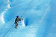 boy ice climbing