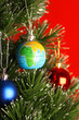 Globe as ornament on christmas tree, christmas concept