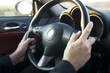 hands on steering wheel