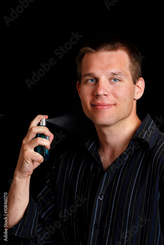 Man+spraying+cologne