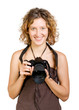 Young beautiful smiling woman holding a photo camera