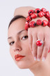 young girl with red coral bracelet