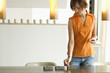 Young woman lighting candles