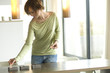 Young woman lighting candles
