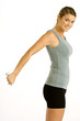 Portrait of a young woman exercising with a dumbbell