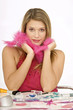 Foto: Portrait of a young woman with a feather boa around her neck Portrait of a young woman with a feather boa around her neck