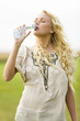 Young woman drinking water from a bottle