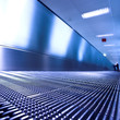 Blue moving escalator in the office hall Blue moving escalator in the office hall