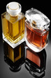 Foto: Perfume bottles over black background Perfume bottles over black background