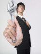 businessman holding monkey wrench businessman holding monkey wrench