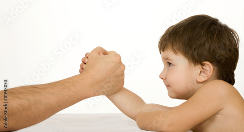 Photo: Boy with father easy wrestling Boy with father easy wrestling
