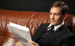 man reads newspaper