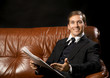 man reads newspaper