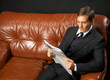 man reads newspaper