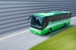 green bus on road
