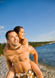 Boyfriend giving girlfriend piggy back ride