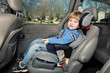 Preschool age boy in a booster seat