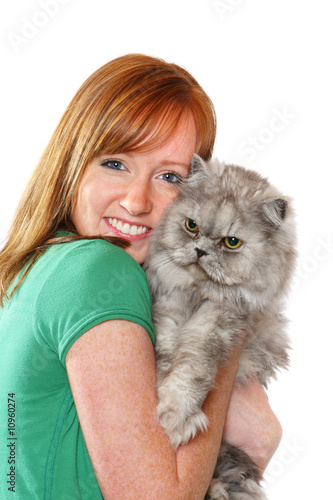 Photo: Smiling teenager holding her cat Smiling teenager holding her cat