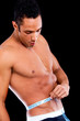 man measuring his waist